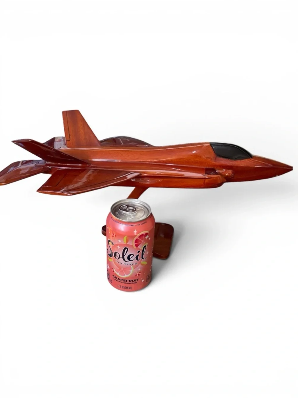 Mahogany wood model of a stealth fighter jet, handcrafted